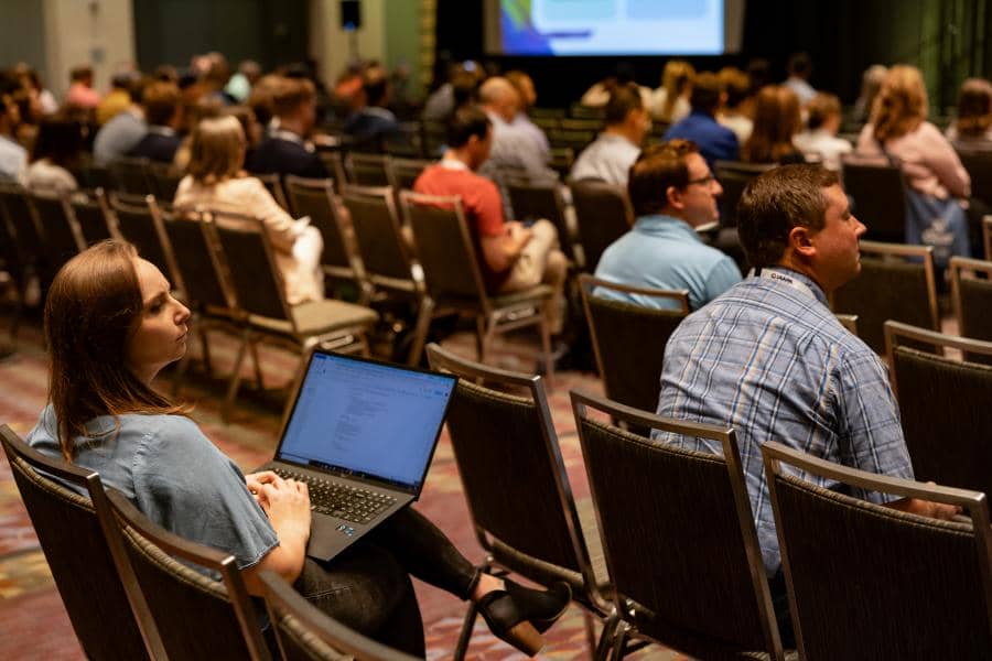 Attendees in focus and concentrating during the Dynamic versus Variable Pricing EDUSession held at IAAPA Expo 2023